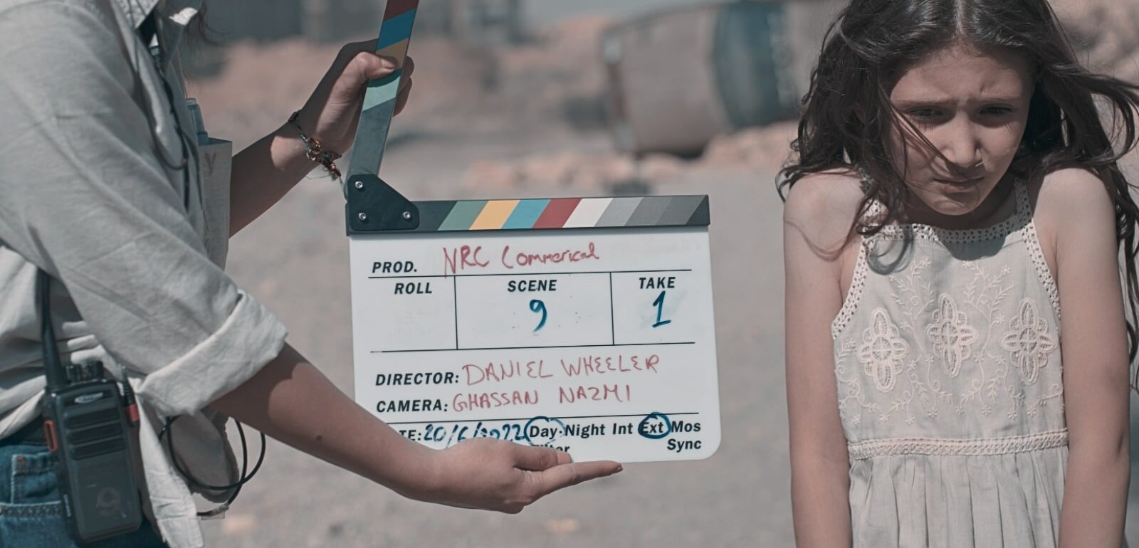 Clapperboard for When Bombs Stop Falling with director Daniel Benjamin Wheeler and child actor work on set.